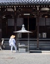 O-henro Buddhist pilgrim in white robes at Kichijoji, temple number 63 of Shikoku Royalty Free Stock Photo