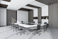 O shape white conference room table for twelve persons. Corner view