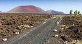 Oad leading to the mountains of fire, Timanfaya Royalty Free Stock Photo