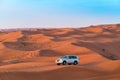 19.11.2017, OAE, Bashing safari on car in red desert. Sunset and dune Royalty Free Stock Photo