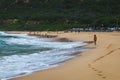 Oahu beach with big waves and many people on sand Royalty Free Stock Photo