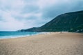 Oahu beach with big waves and many people on sand Royalty Free Stock Photo