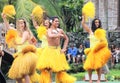 Oahu, Hawaii - 4/26/2018 - Hawaiian dancers performing while riding a canoe float at the Polynesian Cultural Center in Hawaii