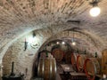 Oak barrels in an old underground wine cellar