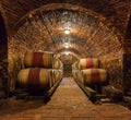 Oak barrels in a underground wine cellar Royalty Free Stock Photo