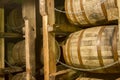 Oak bourbon barrels on rack in warehouse Royalty Free Stock Photo