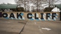 `Oak Cliff` sign on a wall at the Tyler Dart Station in Oak Cliff, Dallas, Texas.