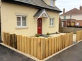 Oak sleeper fence surrounding front garden