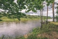 oak tree branches over summer river - vintage effect Royalty Free Stock Photo