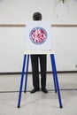 Oak View, California, USA, November 4, 2014, citizen votes in election booth polling station in gymnasium