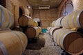 Oak wine barrels in the cellar of a Malbec winery factory in San Juan, Argentina, South America, also seen in Mendoza Royalty Free Stock Photo