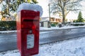 OAKHAM, RUTLAND, ENGLAND- 25 JANUARY 2021: Royal Mail post box covered in snow