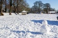 OAKHAM, RUTLAND, ENGLAND- 25 JANUARY 2021: Tiny snowman in Cutts Close park on a snowy day
