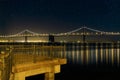 Oakland Bay Bridge by the Pier in San Francisco CA at Night Royalty Free Stock Photo