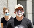 Close up on people wearing personalized face masks at the People`s Strike Coalition car caravan protest