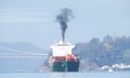 Cargo ship SEASPAN HAMBURG entering the Port of Oakland, Diesel exhaust air pollution Royalty Free Stock Photo