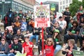 Teachers and supporters holding signs protesting at a Teacher Strike Rally in Oakland, CA