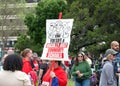 Teachers and supporters holding signs protesting at a Teacher Strike Rally in Oakland, CA