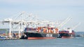 Cargo Ships NYK AQUARIUS and APL KOREA loading at the Port of Oakland Royalty Free Stock Photo