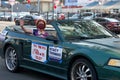 Unidentified protestor in cars and bicycle caravan promoting prop 15