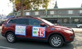 Unidentified protestor in cars and bicycle caravan promoting prop 15