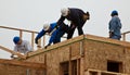 Men build roof for home for Habitat For Humanity Royalty Free Stock Photo