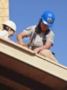 Oakland, Calif - Jan 8, 2011: Volunteers help to build new homes for the poor Royalty Free Stock Photo
