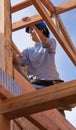 Woman builds roof for home for Habitat For Humanity Royalty Free Stock Photo