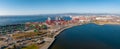 The Oakland Outer Harbor aerial view. Loaded trucks moving by Container cranes.