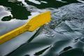 Oar of boat touching water