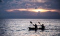 Oarsman silhouette with sunset Royalty Free Stock Photo