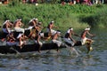 Oarsmen wearing traditional kerala dress row thier snake boat in the Aranmula boat race