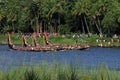 Oarsmen wearing traditional kerala dress row thier snake boat in the Aranmula boat race