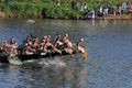 Oarsmen wearing traditional kerala dress row thier snake boat in the Aranmula boat race