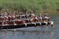 Oarsmen wearing traditional kerala dress row thier snake boat in the Aranmula boat race