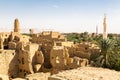 Oasis, ruins of ancient middle eastern Arab town built of mud bricks, old mosque, minaret. Al Qasr, Dakhla, Western Desert, Egypt.