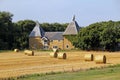 Oast house and hay bales Royalty Free Stock Photo