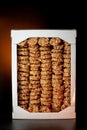 Oat and corn flakes cookies. Healthy natural food. Rows are stacked on top of each other. Black background. Vertical photo. Packed