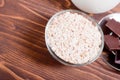 Oat flakes in a bowl next to a carafe of milk and chocolate on b Royalty Free Stock Photo