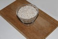 Oat flakes in a bowl on a wooden stand