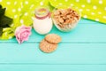 Oat Flakes And Cookies With Jug Of Milk In The Cafe. Tablecloth In Polka Dots And Pink Rose. Selective Focus. Copy Space And Mock