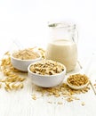 Oat flakes with flour and milk on white board