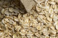 Oat flakes poured into a linen cloth bag Royalty Free Stock Photo