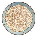 Oat flakes with wheat bran in round bowl isolated Royalty Free Stock Photo