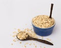 Oat flakes with wooden spoon