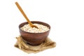 Oat flakes with a wooden spoon and wheat spike