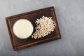 Oat milk - fresh organic and vegetarian non dairy alternative milk. Top view, selective focus