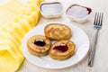 Oat pancakes with blueberry jam, strawberry jam, yellow napkin, Royalty Free Stock Photo