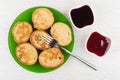 Oat pancakes, fork in plate, blueberry jam, strawberry jam Royalty Free Stock Photo