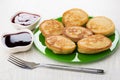 Oat pancakes in plate, blueberry jam, strawberry jam, fork